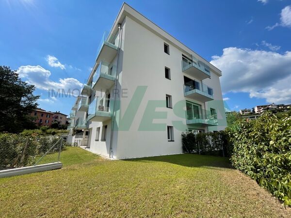 new, small and elegant apartment building in sunny location