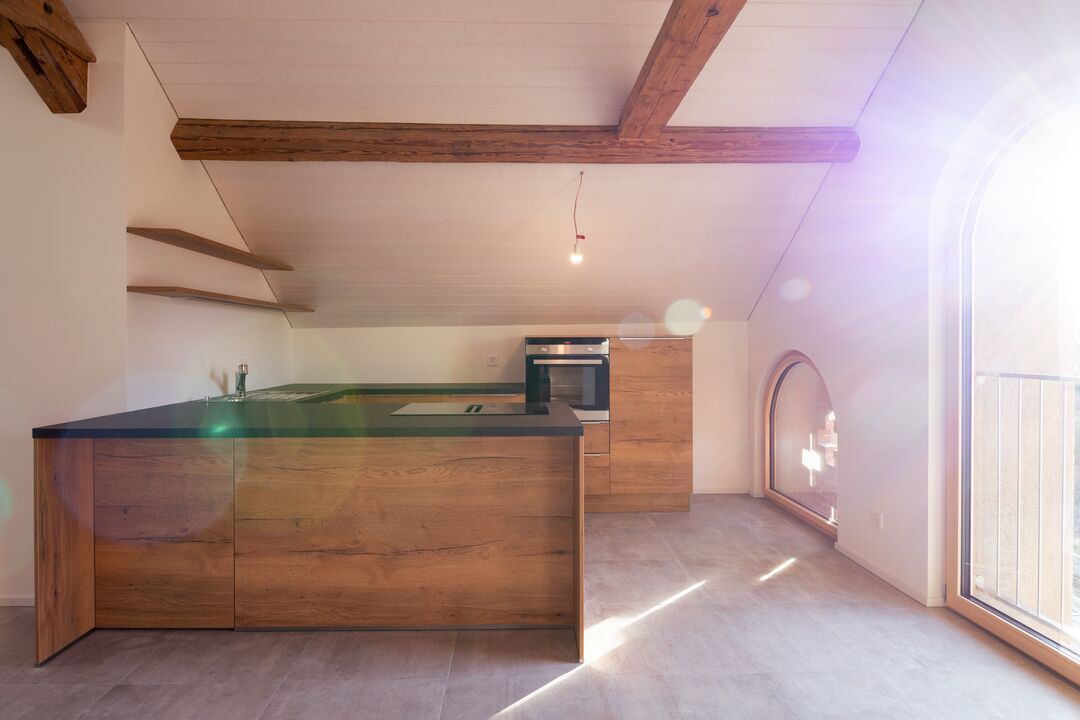 Rénovation d'une ferme du 19e siècle en 15 appartements à Roche : l'intérieur.