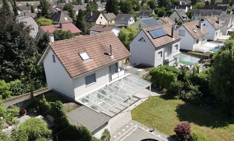 Detached house with garage and gardens with pond