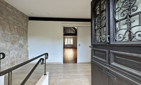 Single-family house attached on one side with balcony and garage