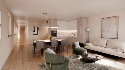 a living room and kitchen in a modern apartment with white furniture