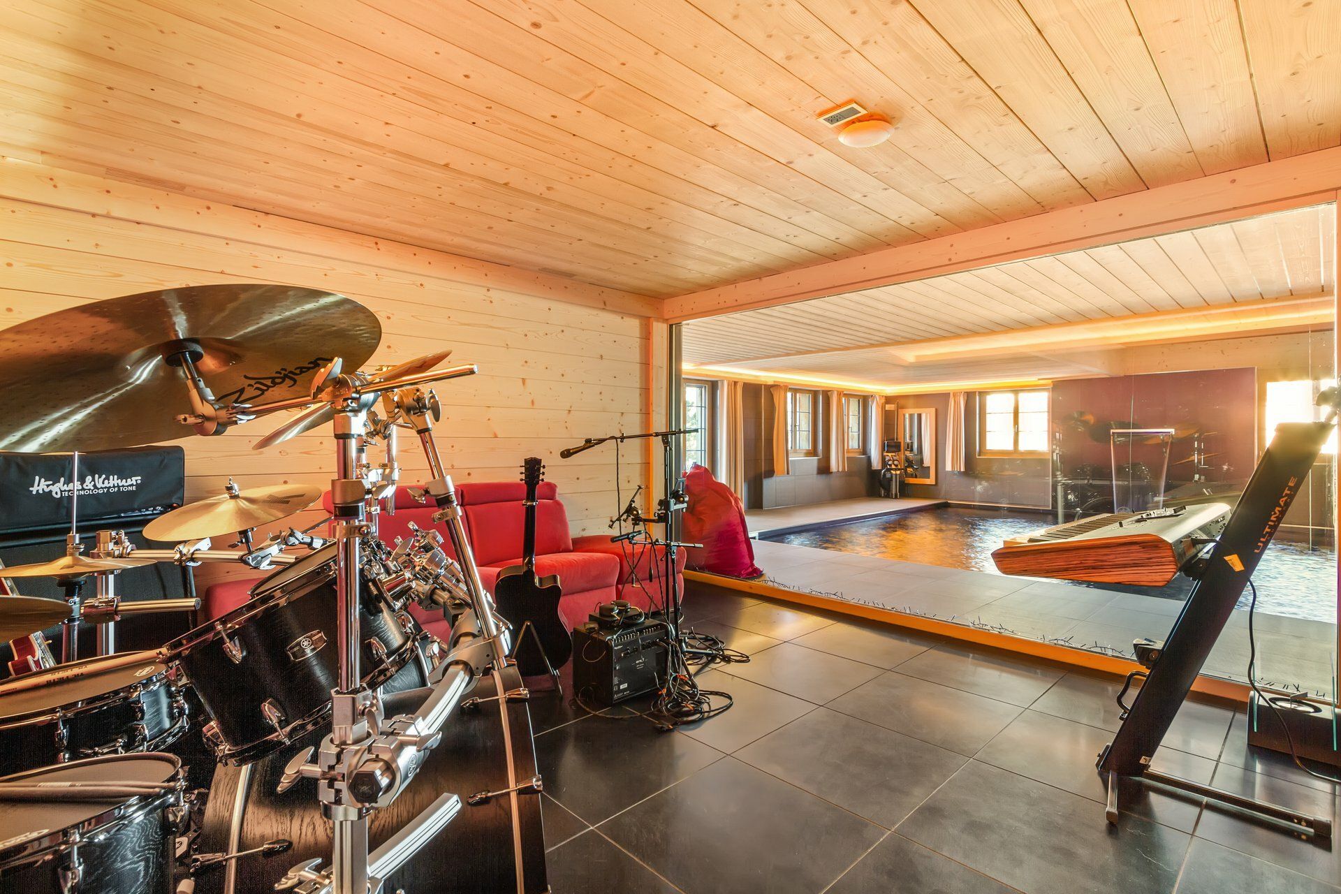 Music/fitness room with pool view
