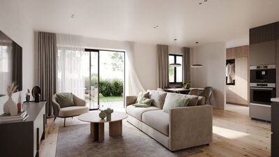 a living room and kitchen in a modern apartment with large open windows