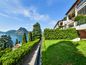 Elegante Duplex con Giardino e Vista Mozzafiato sul Lago di Lugano
