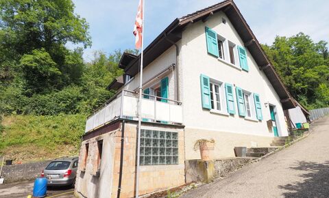 Single-family house in need of renovation with garage and barn