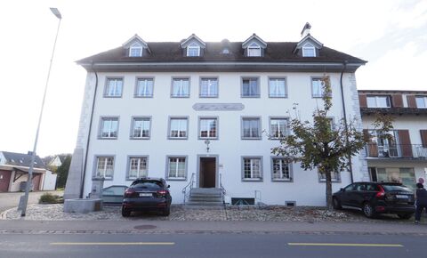 Well maintained condominium in historic building with garage box