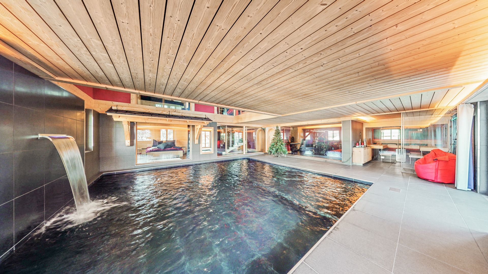 Indoor swimming pool with waterfall