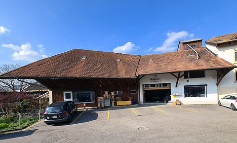 Building comprising warehouse, offices, storage area and workshop