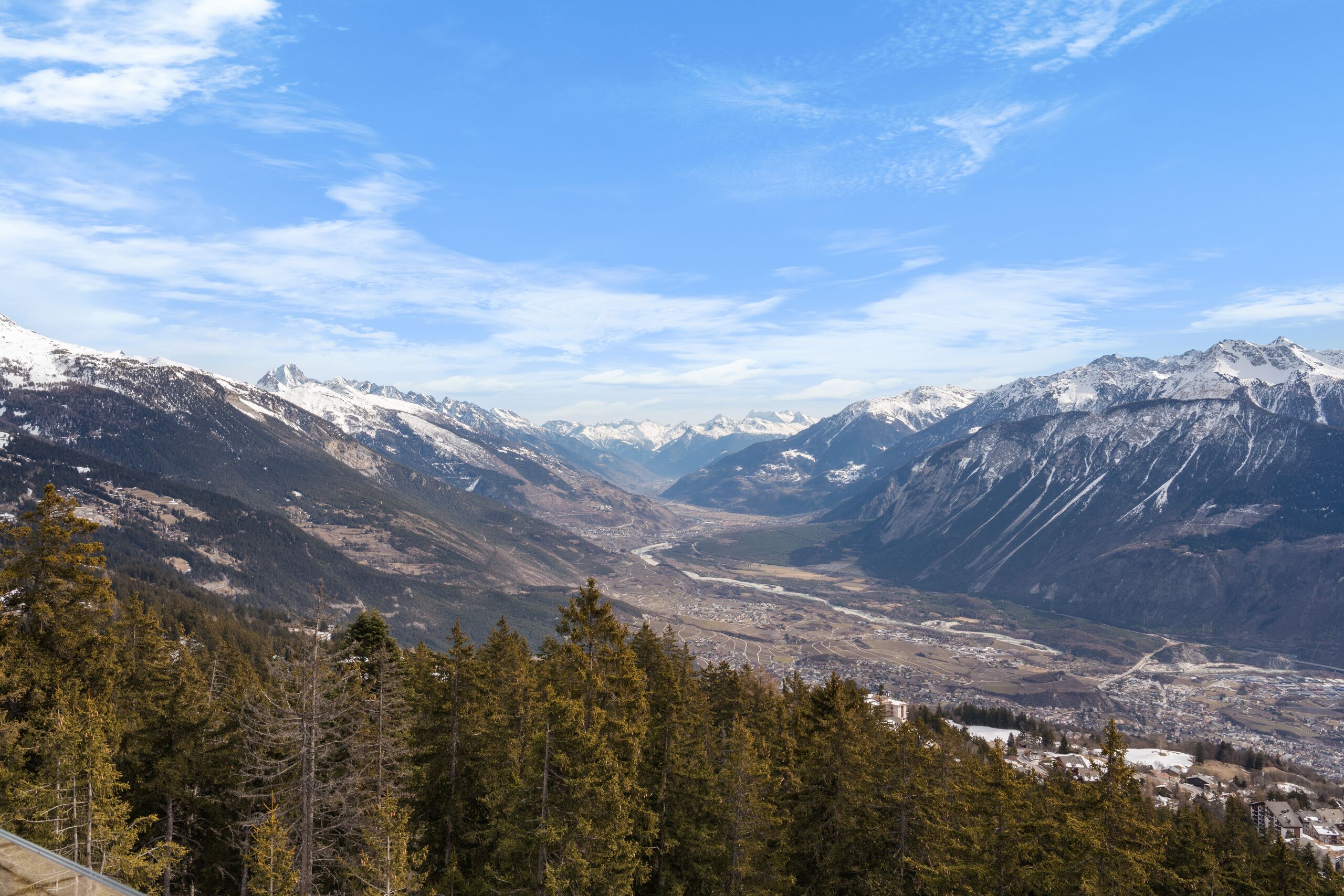 a view of a city and mountain range from the top