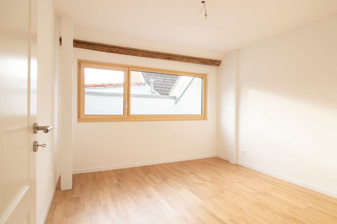 Rénovation d'une ferme du 19e siècle en 15 appartements à Roche : l'intérieur.