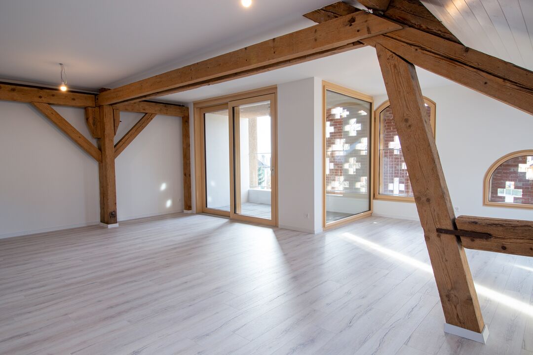 Rénovation d'une ferme du 19e siècle en 15 appartements à Roche : l'intérieur.