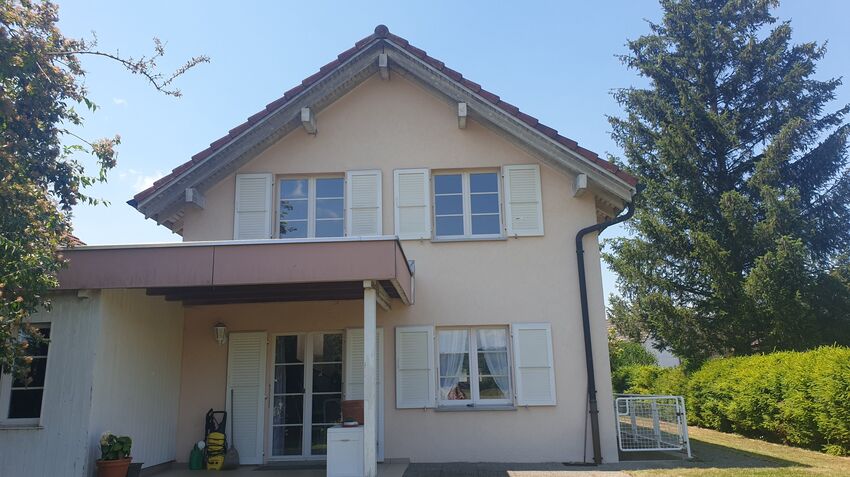 Semi-detached house joined by garages