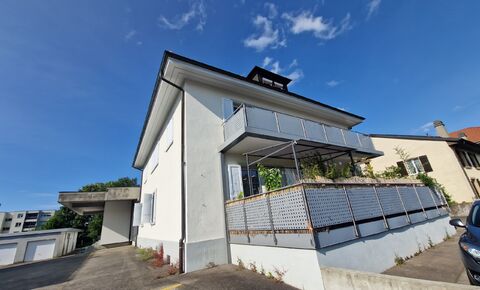 Immeuble locatif de 4 appartements, garages et parcelle constructible