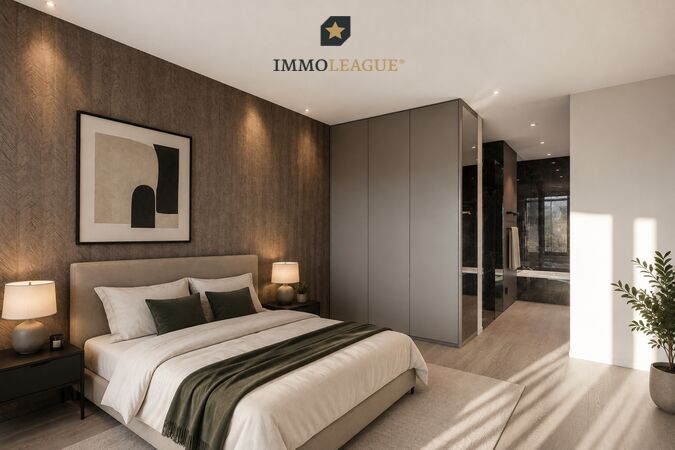Das Schlafzimmer bietet direkten Zugang zum grossen Bad. Der harmonisch integrierte Einbauschrank rundet das exklusive Raumgefühl ab. 