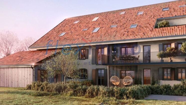 a large home with a sloping roof and a balcony