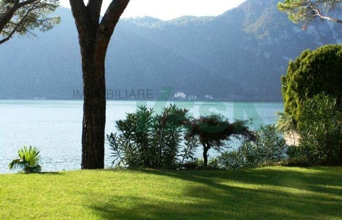 Elegant lake-front apartment with private garden and swimming pool