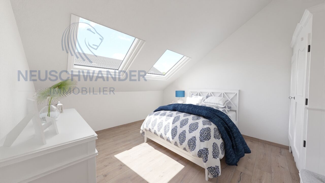 une petite chambre avec un lit blanc et une lucarne