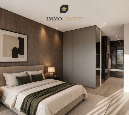 Das Schlafzimmer bietet direkten Zugang zum grossen Bad. Der harmonisch integrierte Einbauschrank rundet das exklusive Raumgefühl ab. 