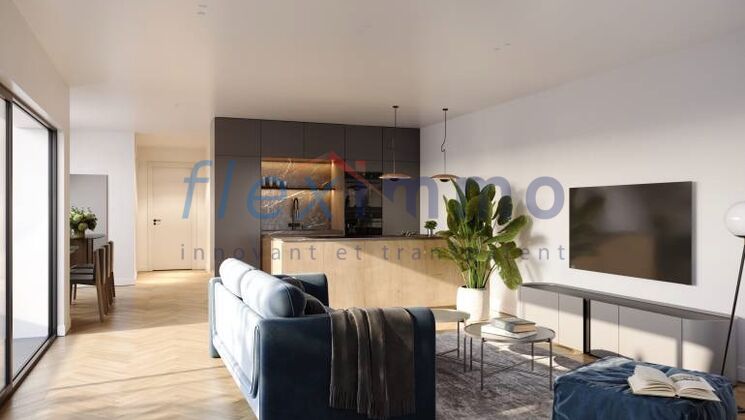 a modern apartment with hardwood floors, a large living room with a blue couch, a tv, and a table with a plant plant on it