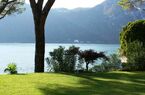 Elegant lake-front apartment with private garden and swimming pool