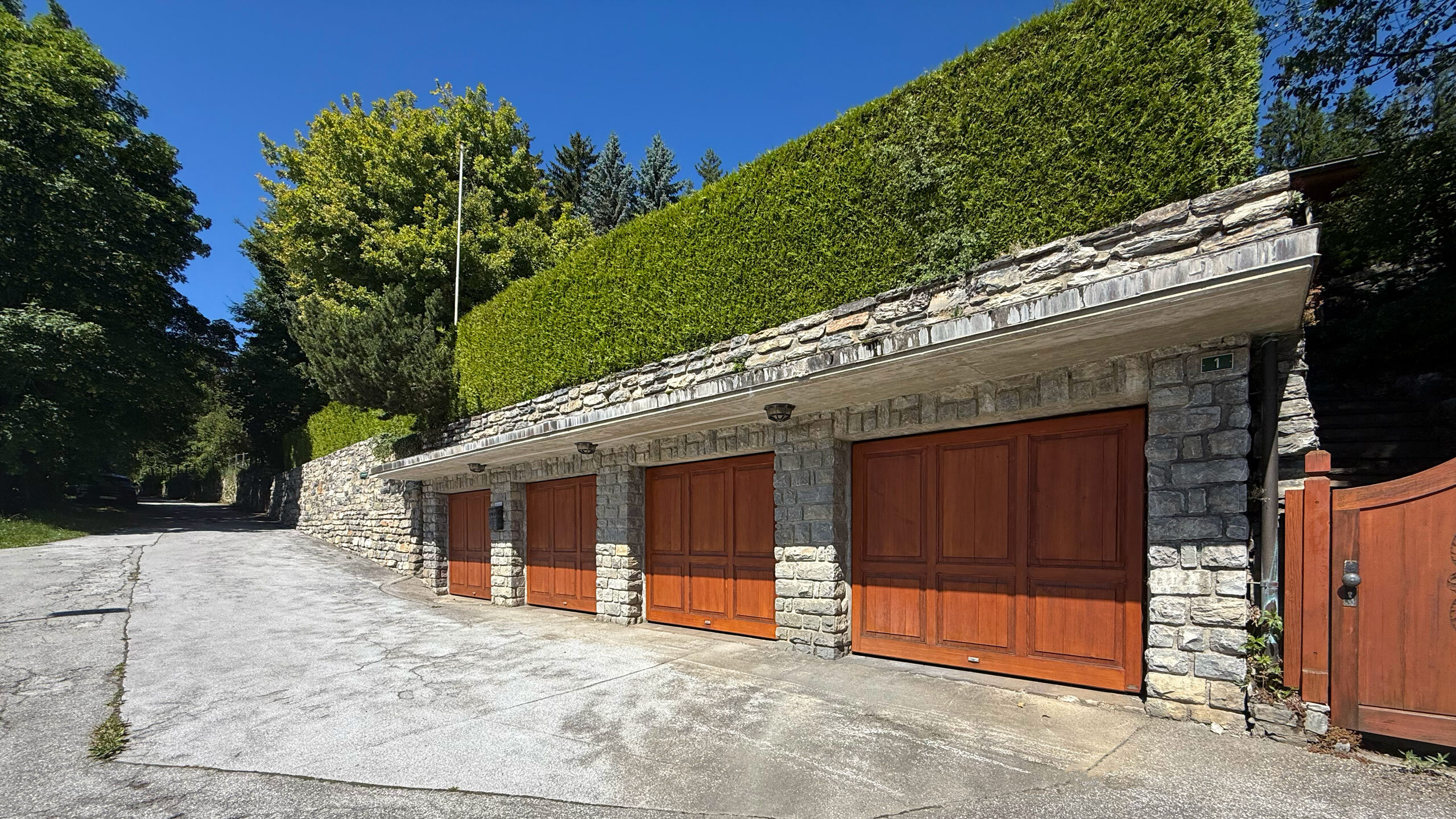 Four (4) outdoor garage stalls Four (4) outdoor garage stalls