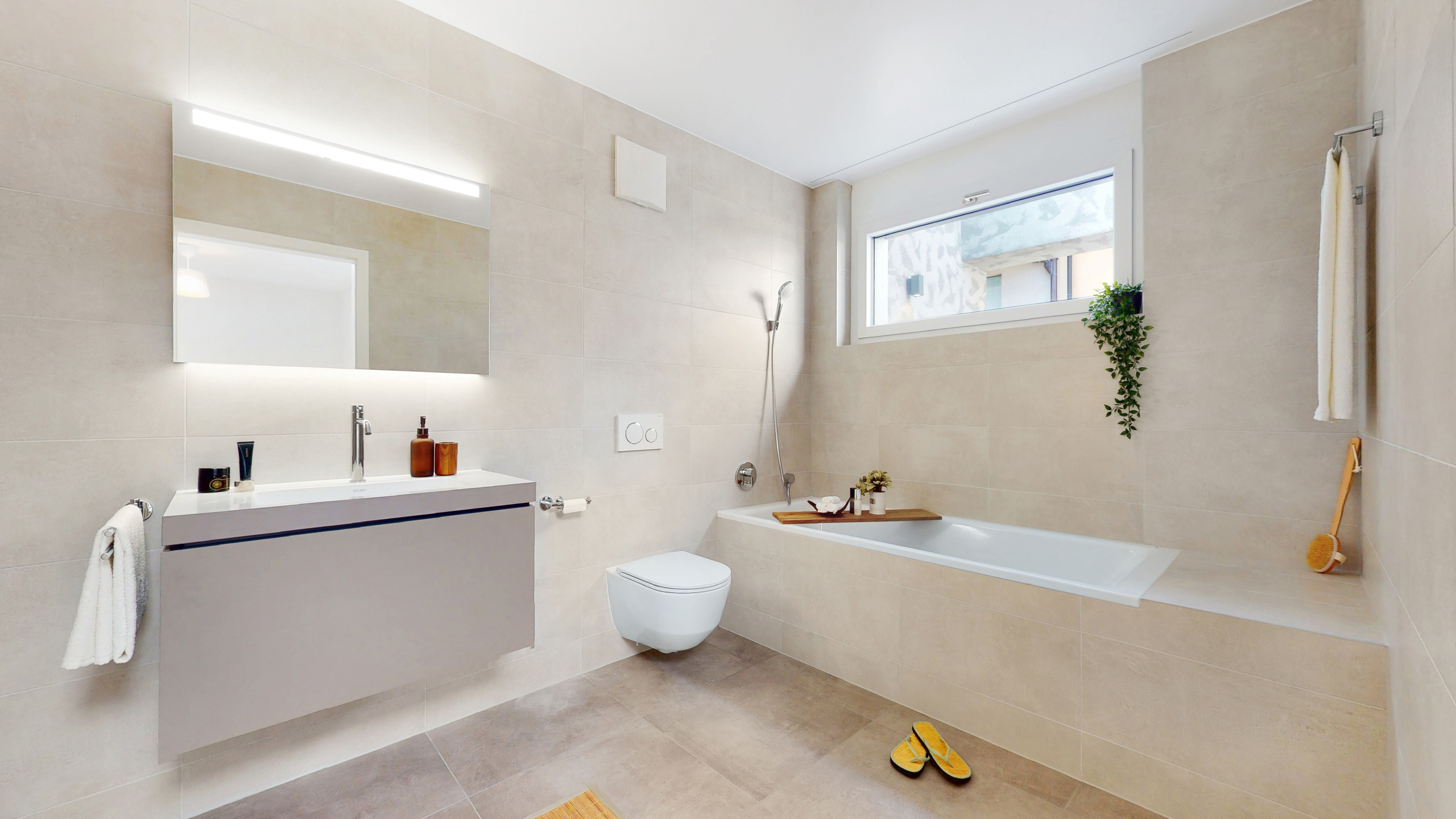 Badezimmer mit Badewanne und privater Waschküche