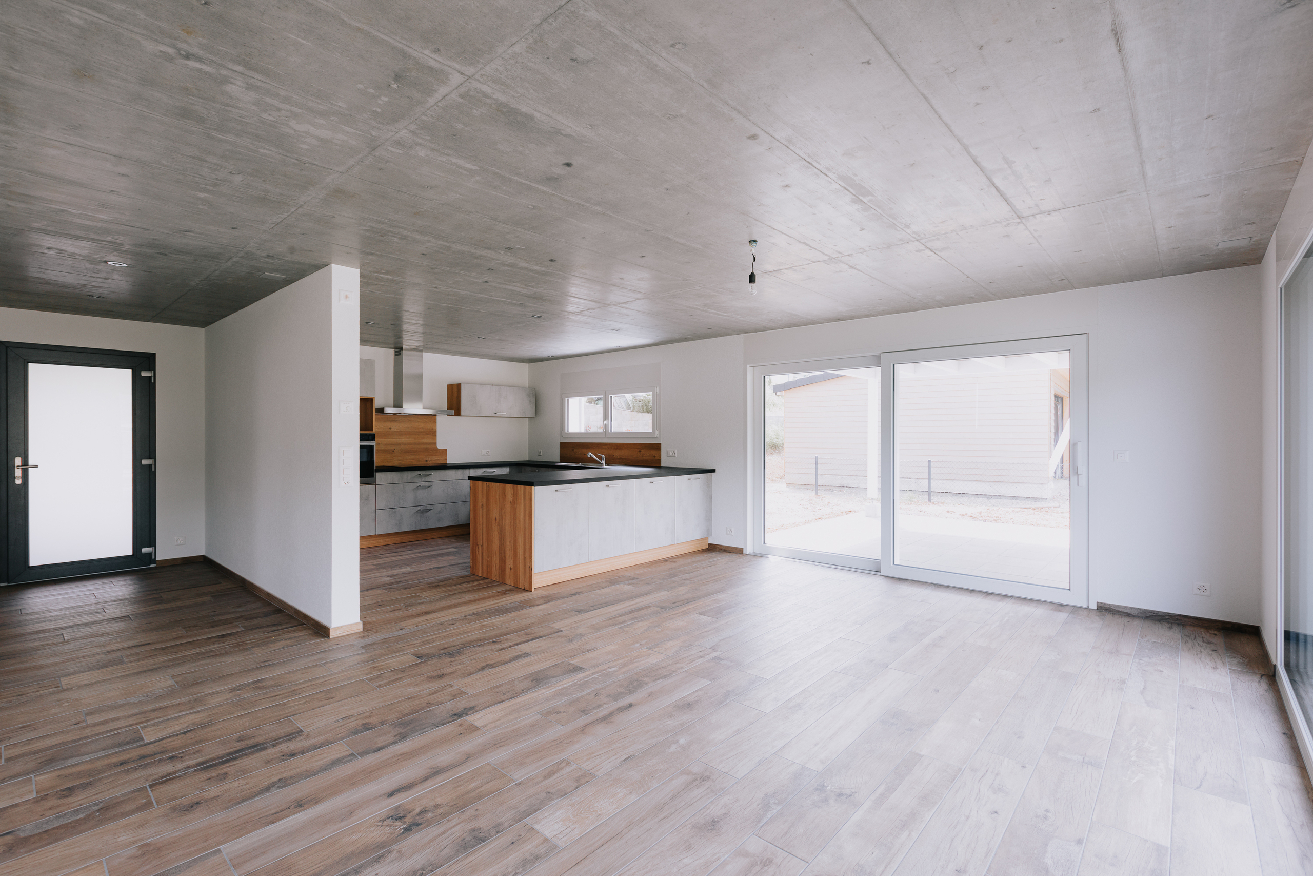 Kitchen open to living room with terrace access
