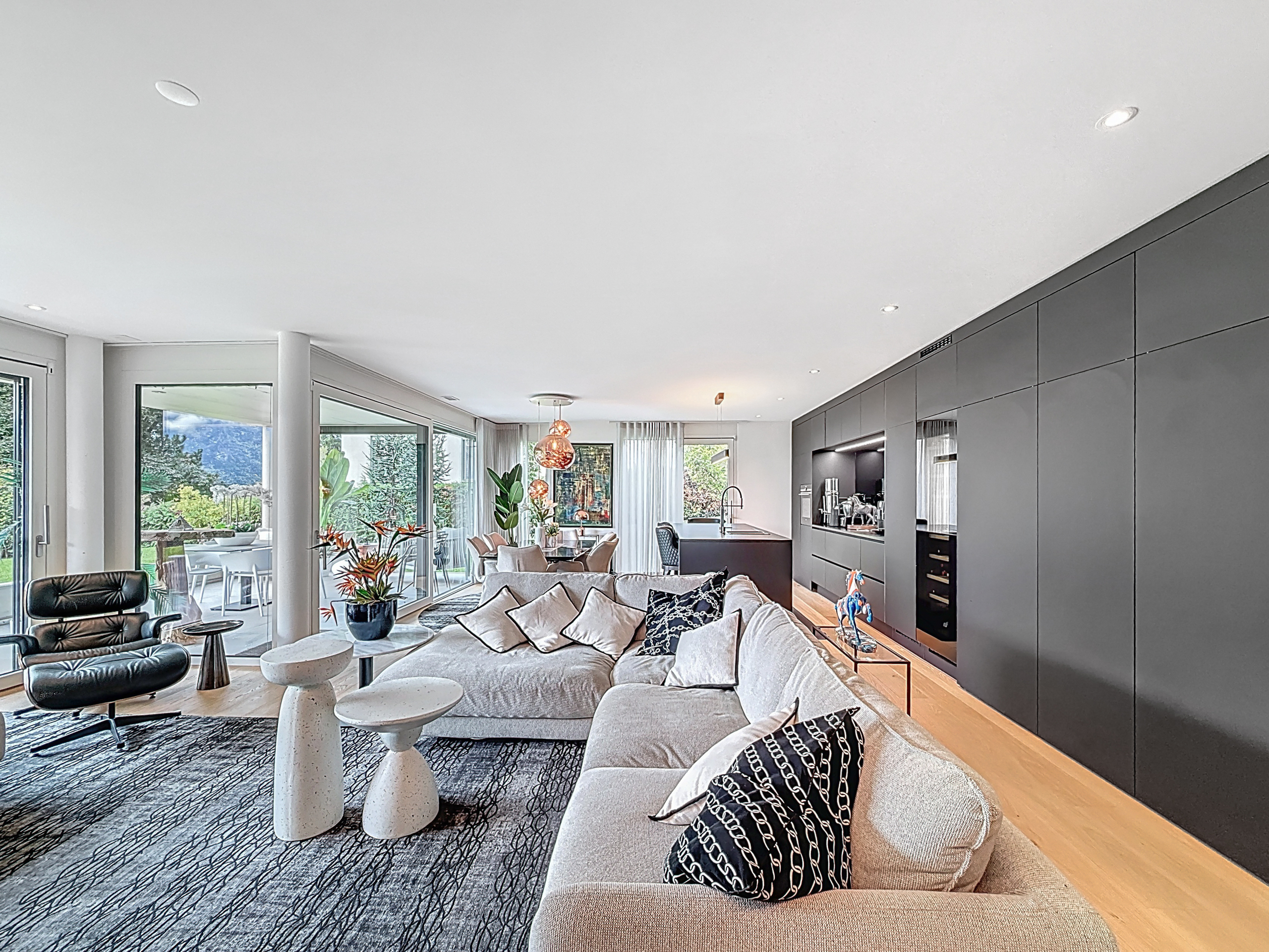 a picture of a modern living room with large windows a picture of a modern living room with large windows