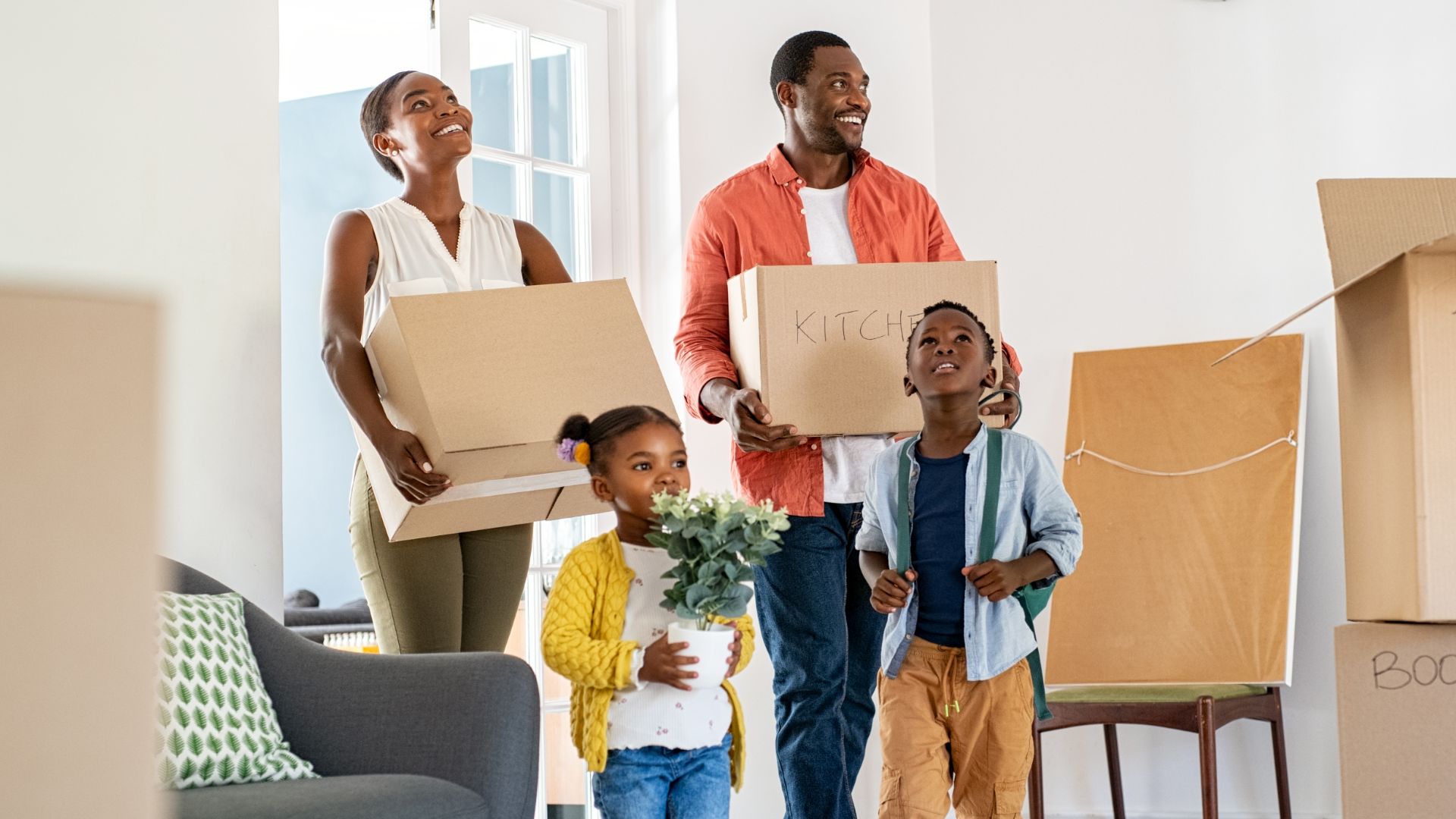 Family with children moving into a new home, illustrating Switzerland’s housing crisis and growing housing shortage.