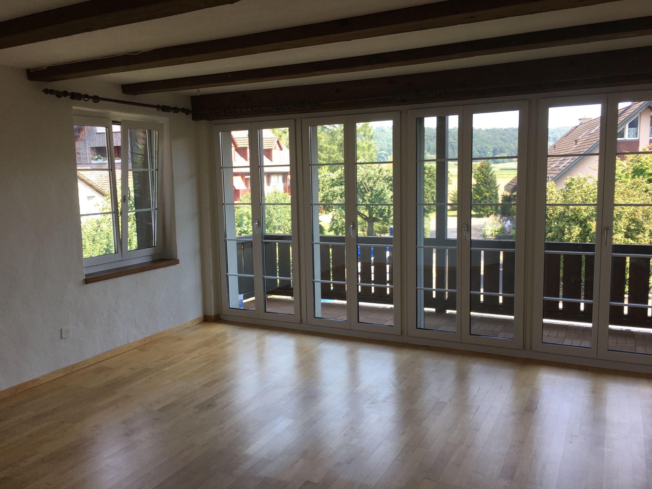 Das Wohnzimmer mit Balkon