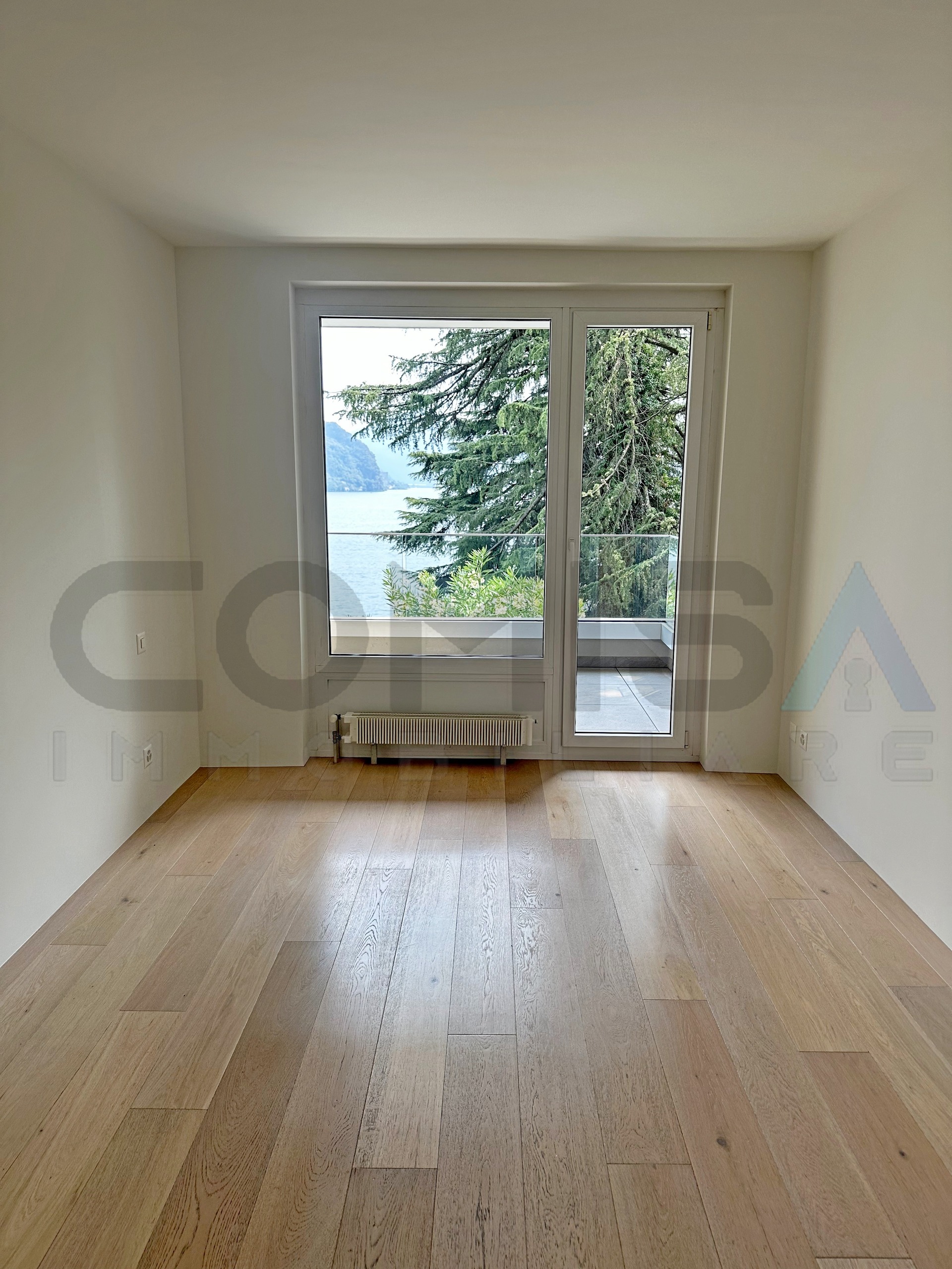 camera letto vista lago