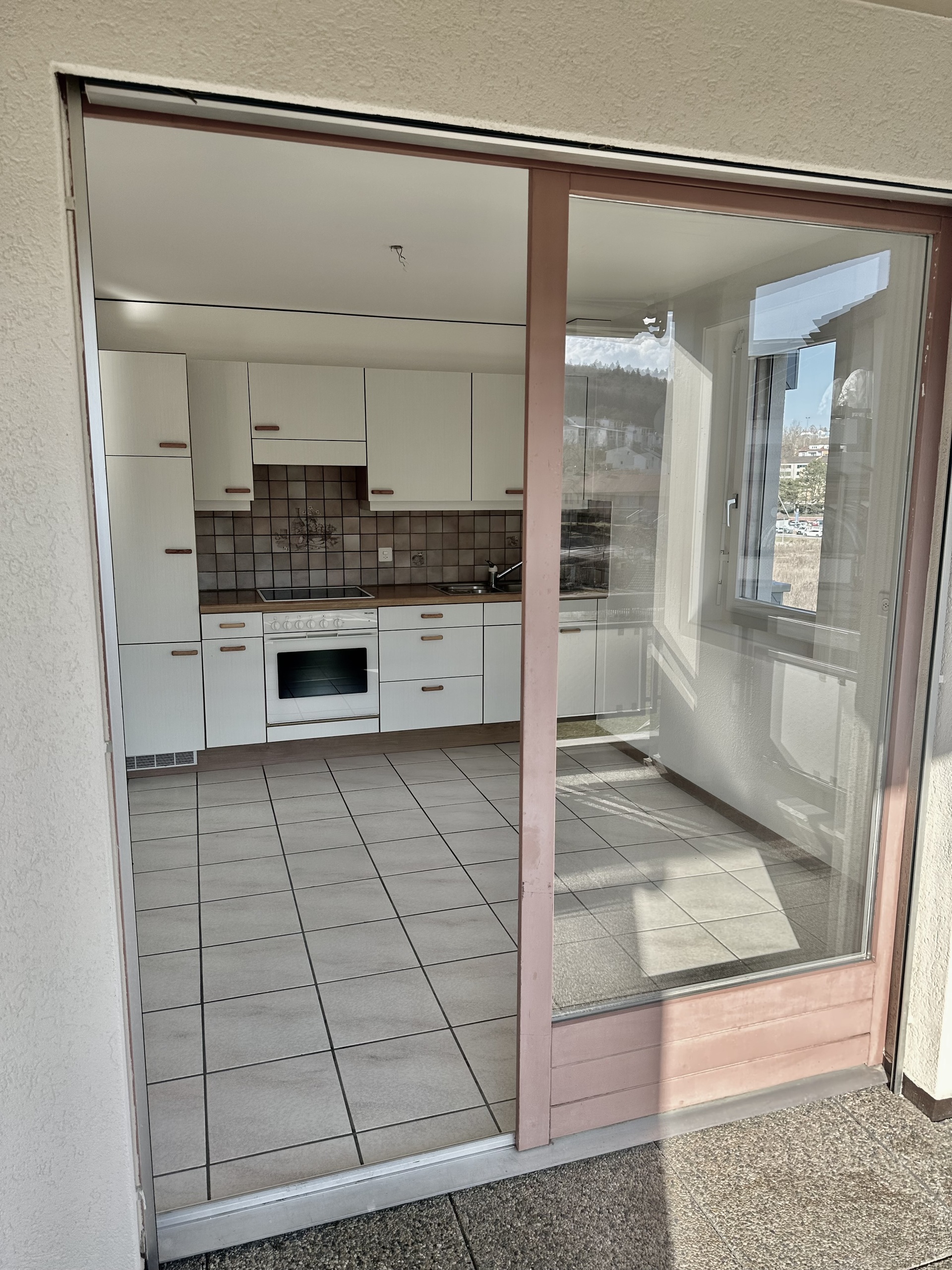 Accès cuisine / balcon