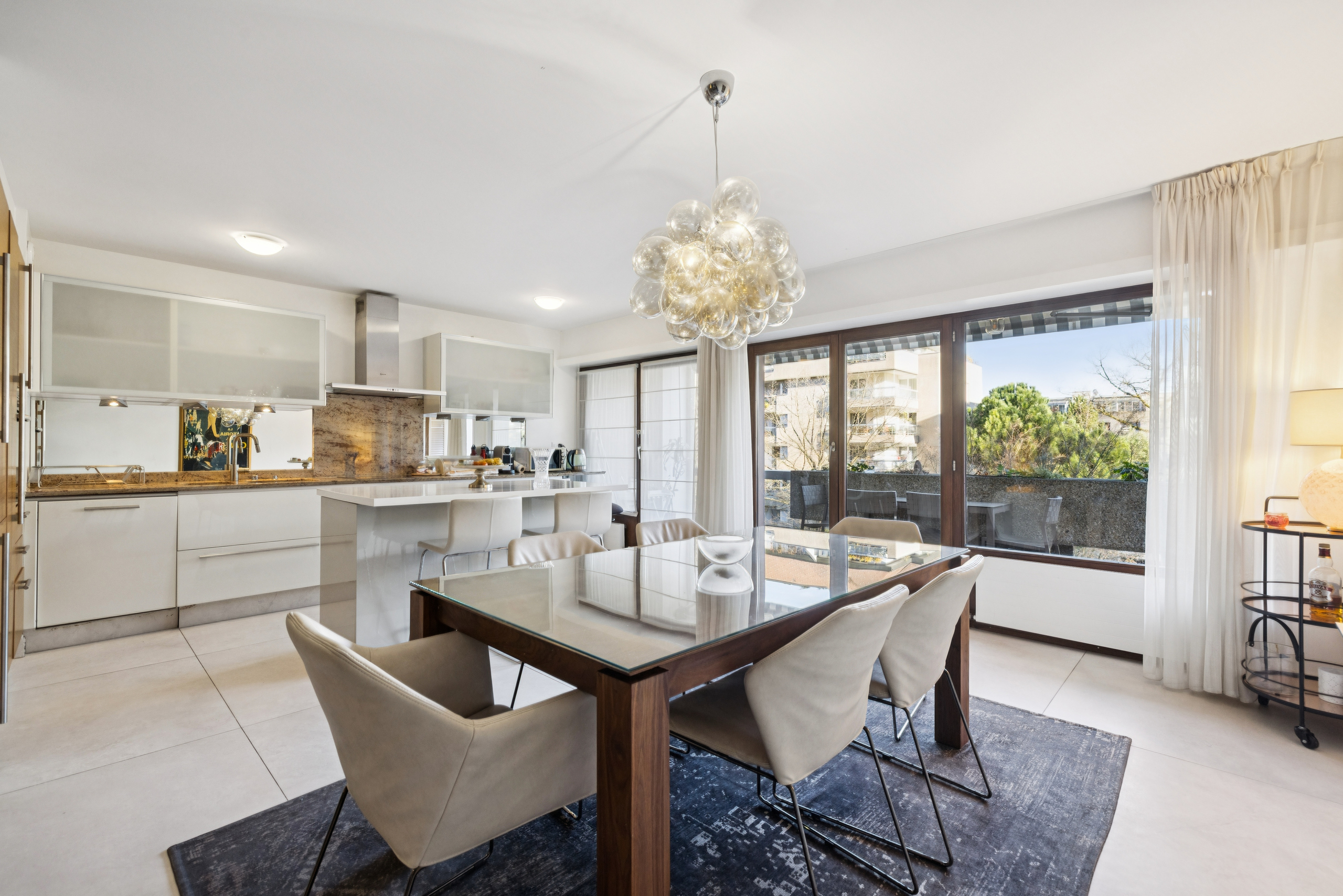 Kitchen with plenty of storage space, opening onto dining room and first balcony