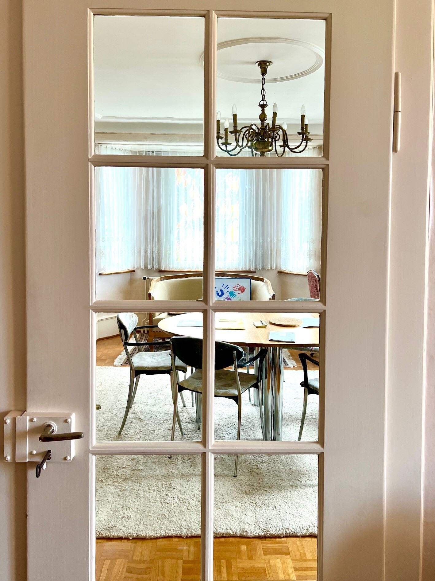 the dining room and living room are separated by a sliding glass door that leads to the living room and dining room