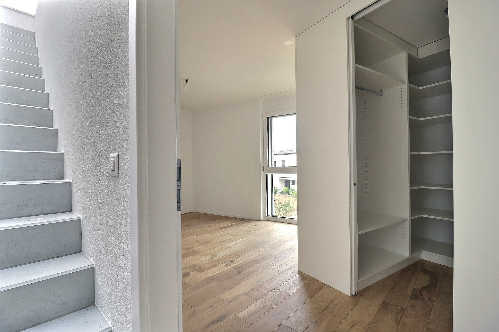 Dressing avec portes coulissantes dans chambre parentale Dressing avec portes coulissantes dans chambre parentale