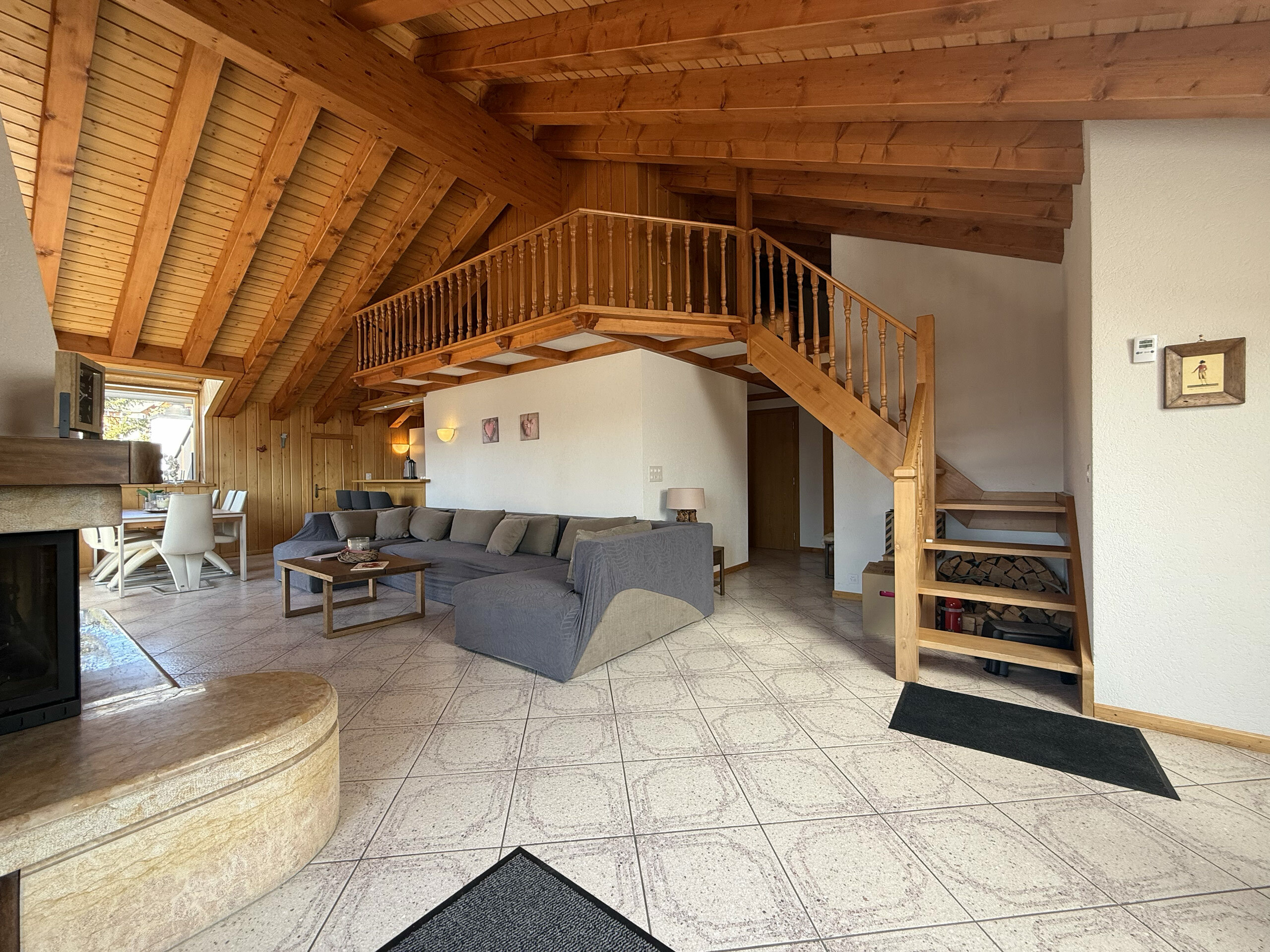 Living room with stairs to mezzanine Living room with stairs to mezzanine