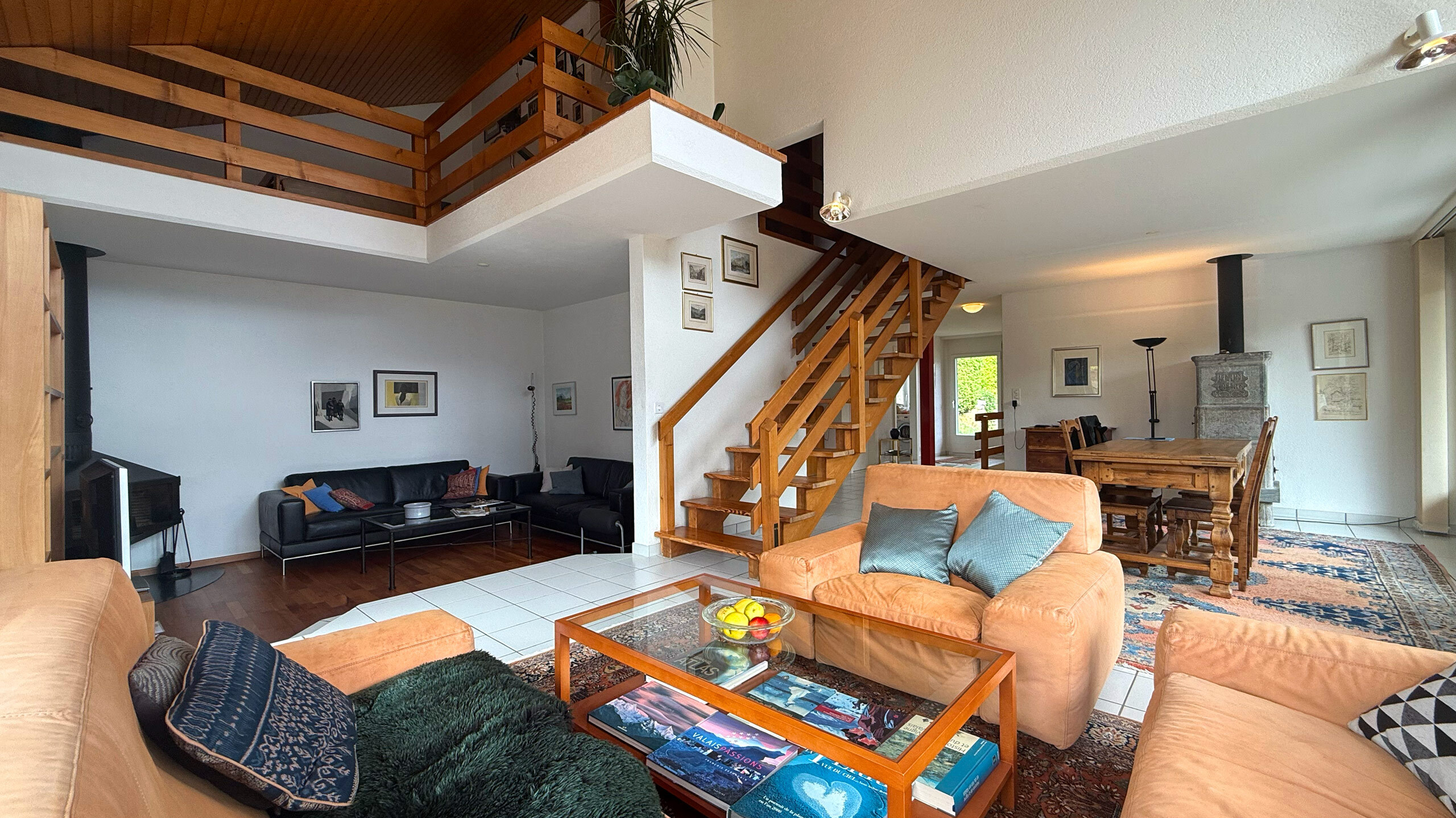 Overview of TV corner, living room, dining room and mezzanine Overview of TV corner, living room, dining room and mezzanine