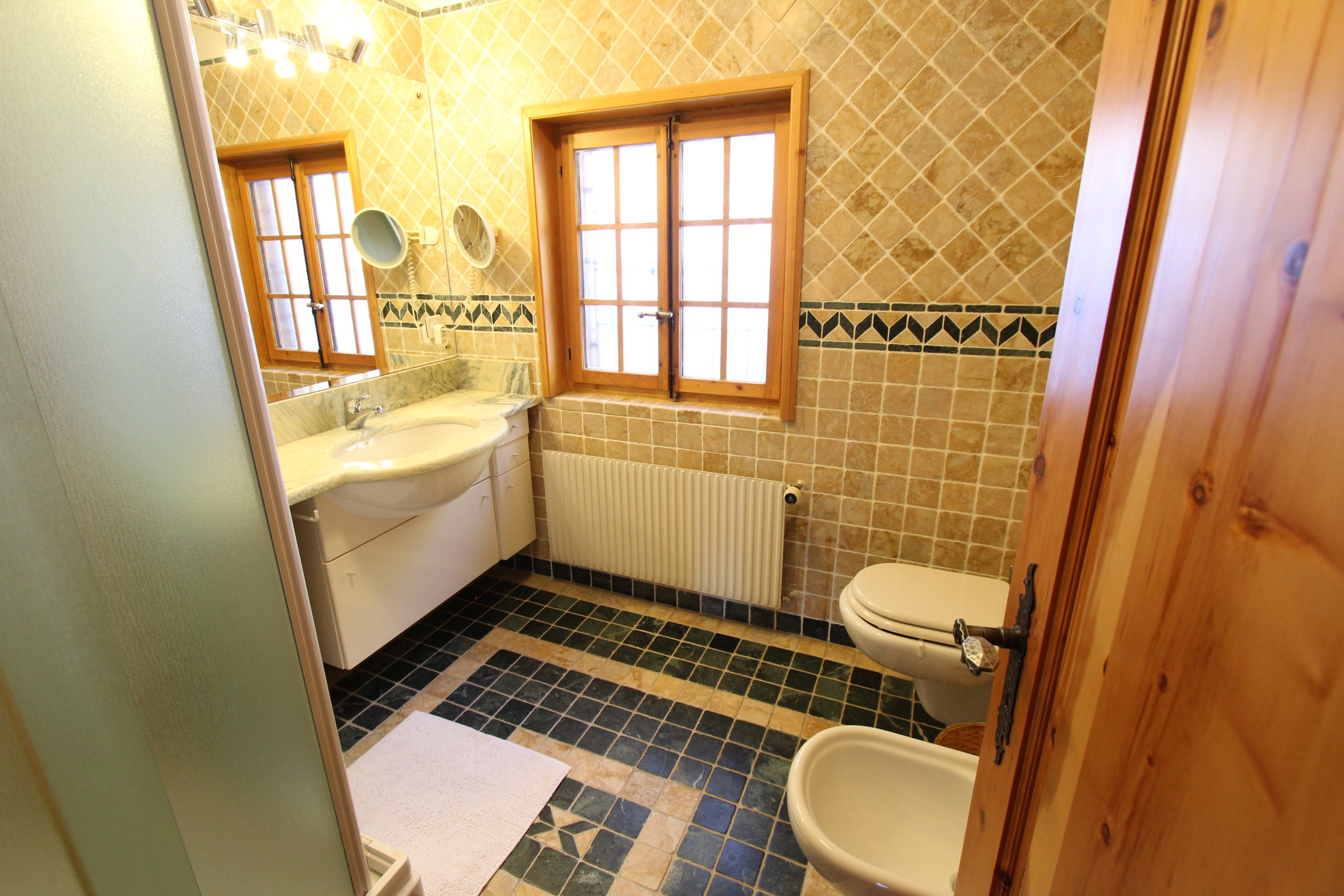 First Floor / Bathroom with shower, sink, bidet and toilet