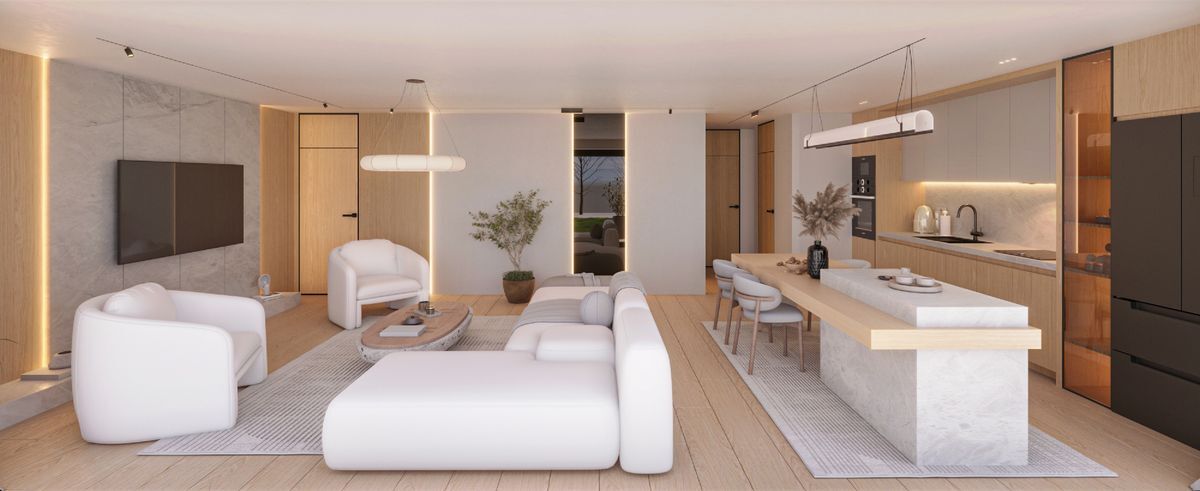 Espace ouvert avec salon moderne et cuisine équipée élégante.