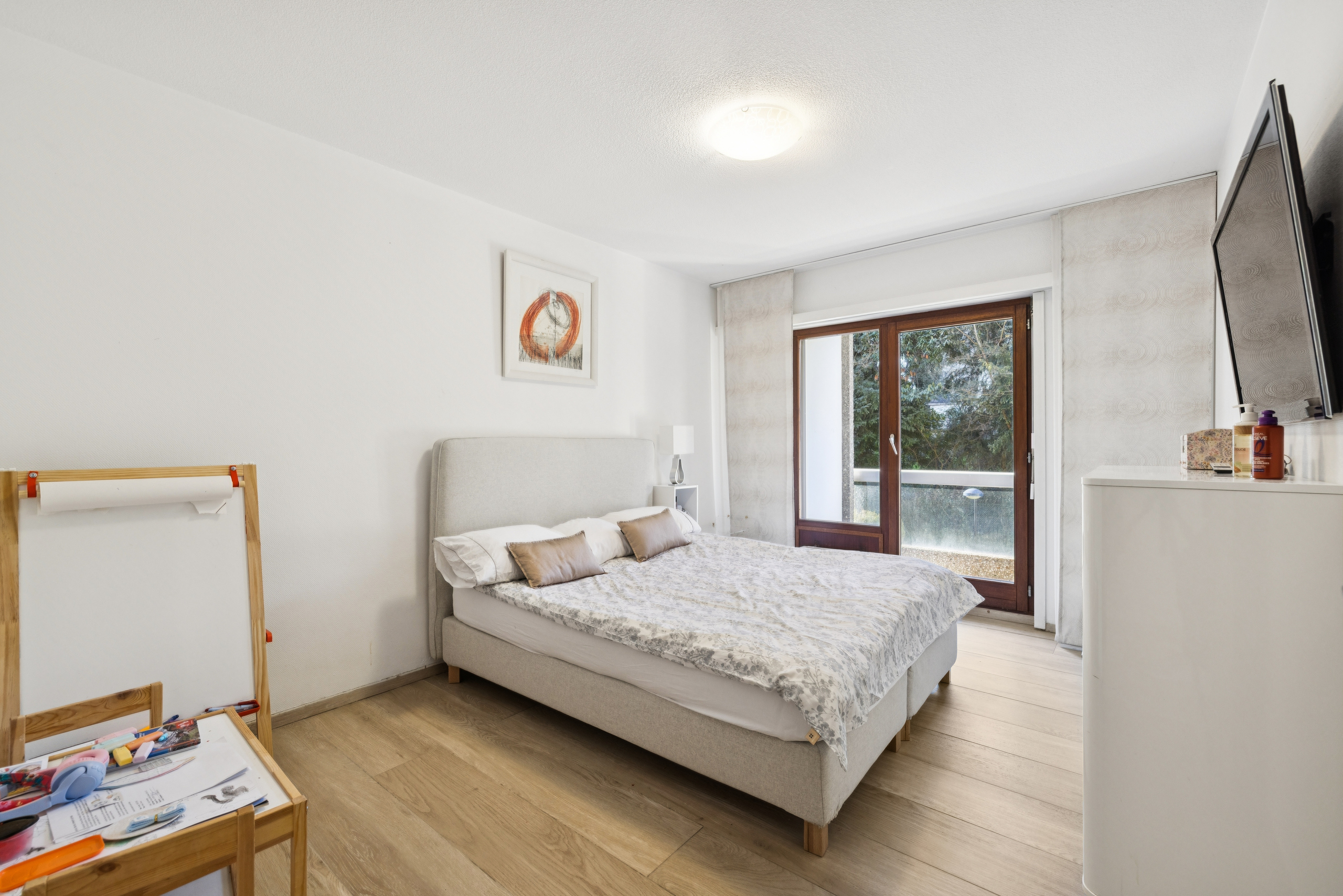 Spacious bedroom with balcony access