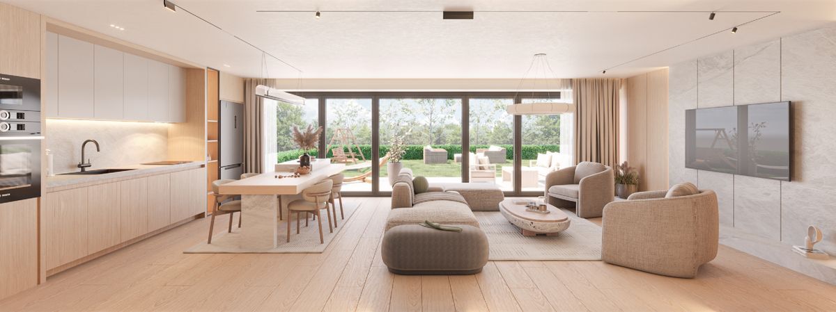 Espace ouvert avec cuisine moderne et vue sur le jardin.