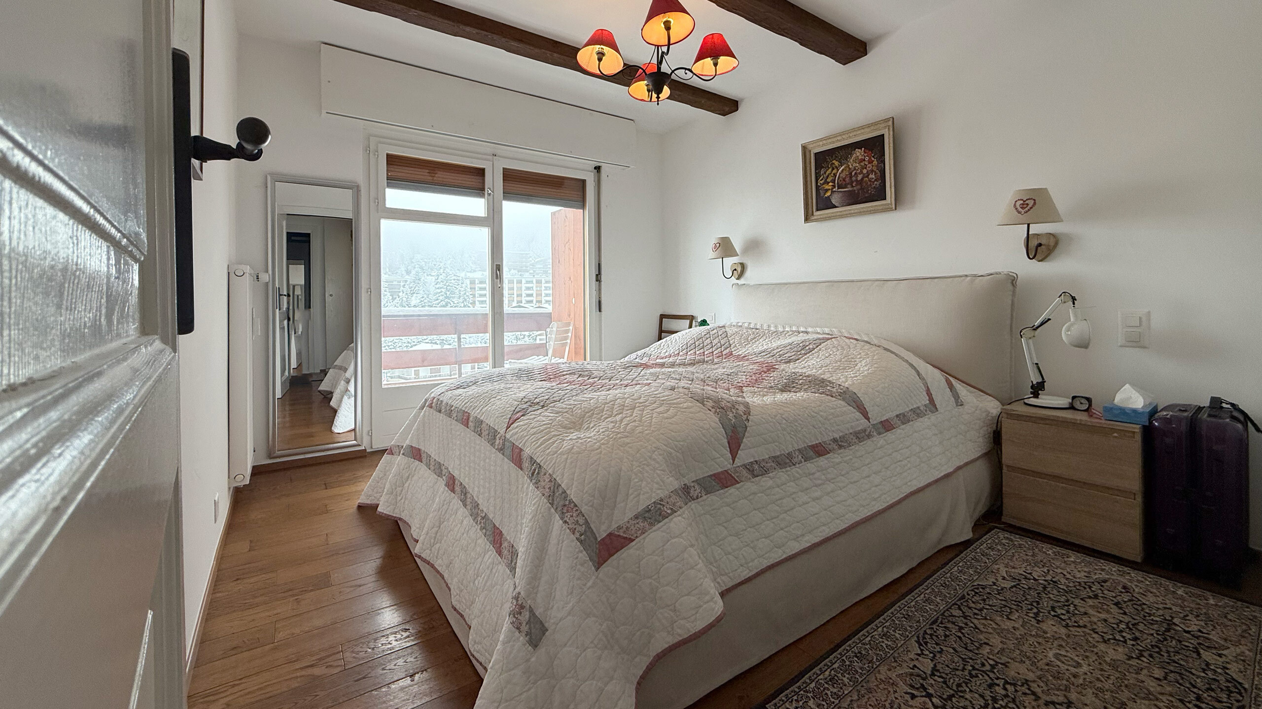 Chambre principale avec accès au balcon Nord