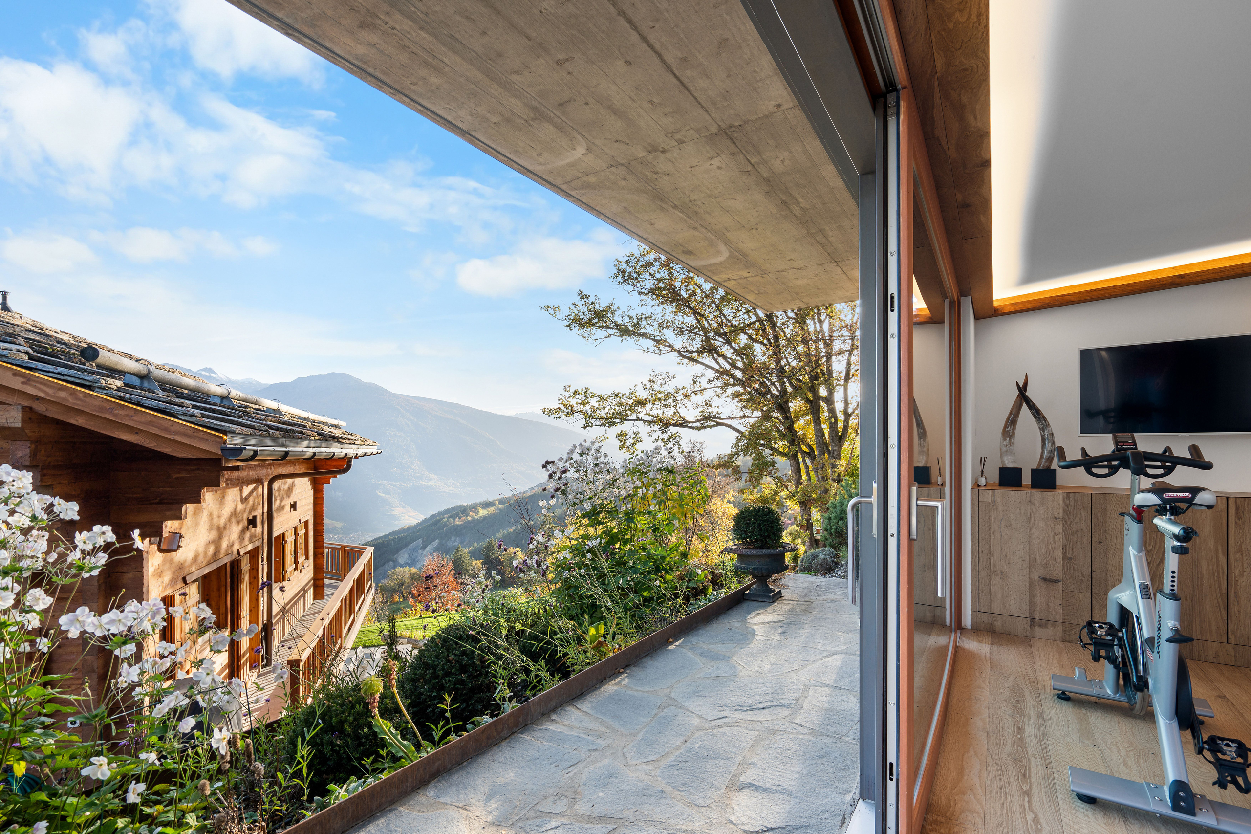 this home has a large balcony overlooking the mountains