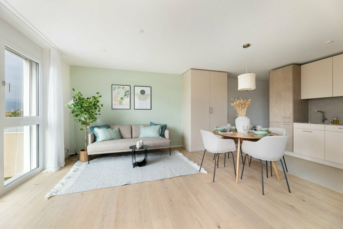 a living room with a table, chairs and a couch