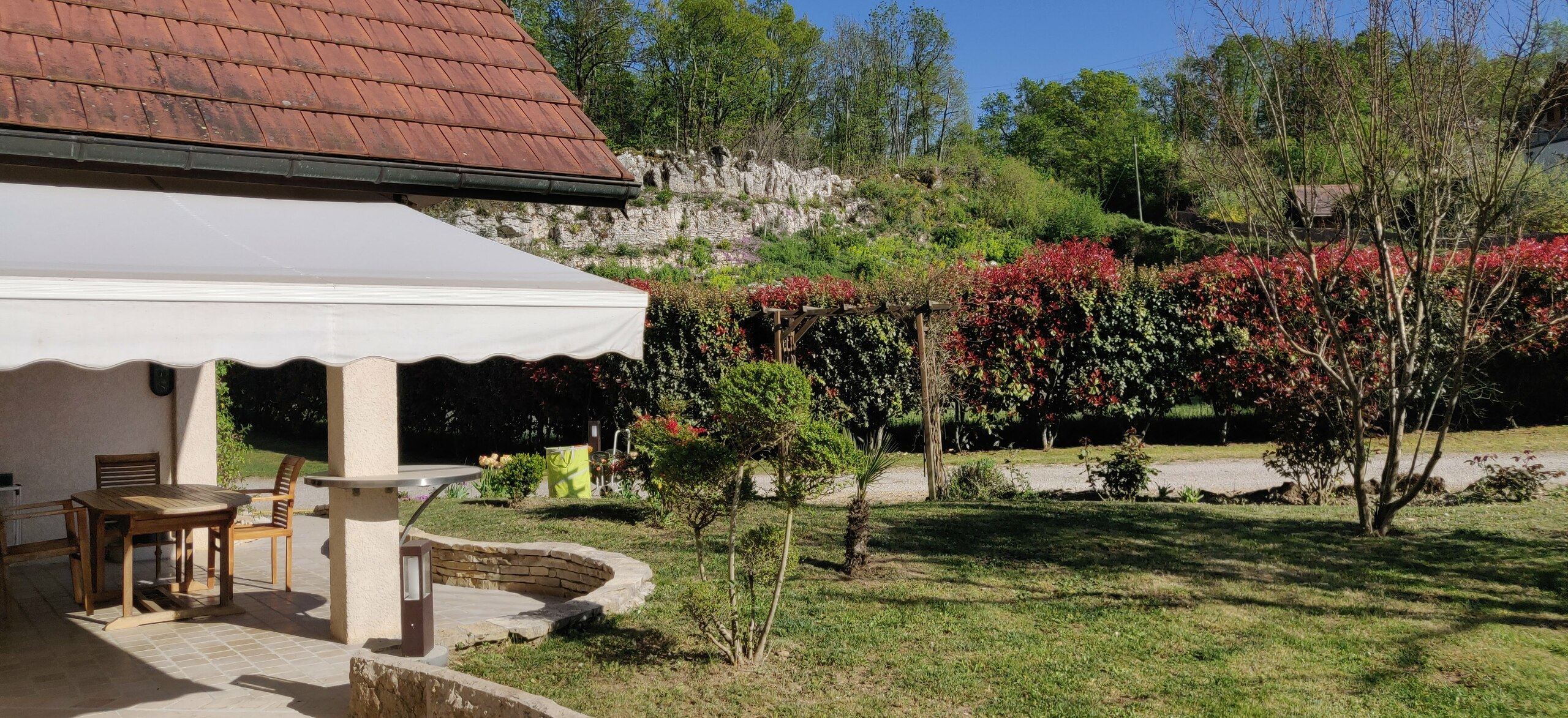 the back yard of a house with a patio