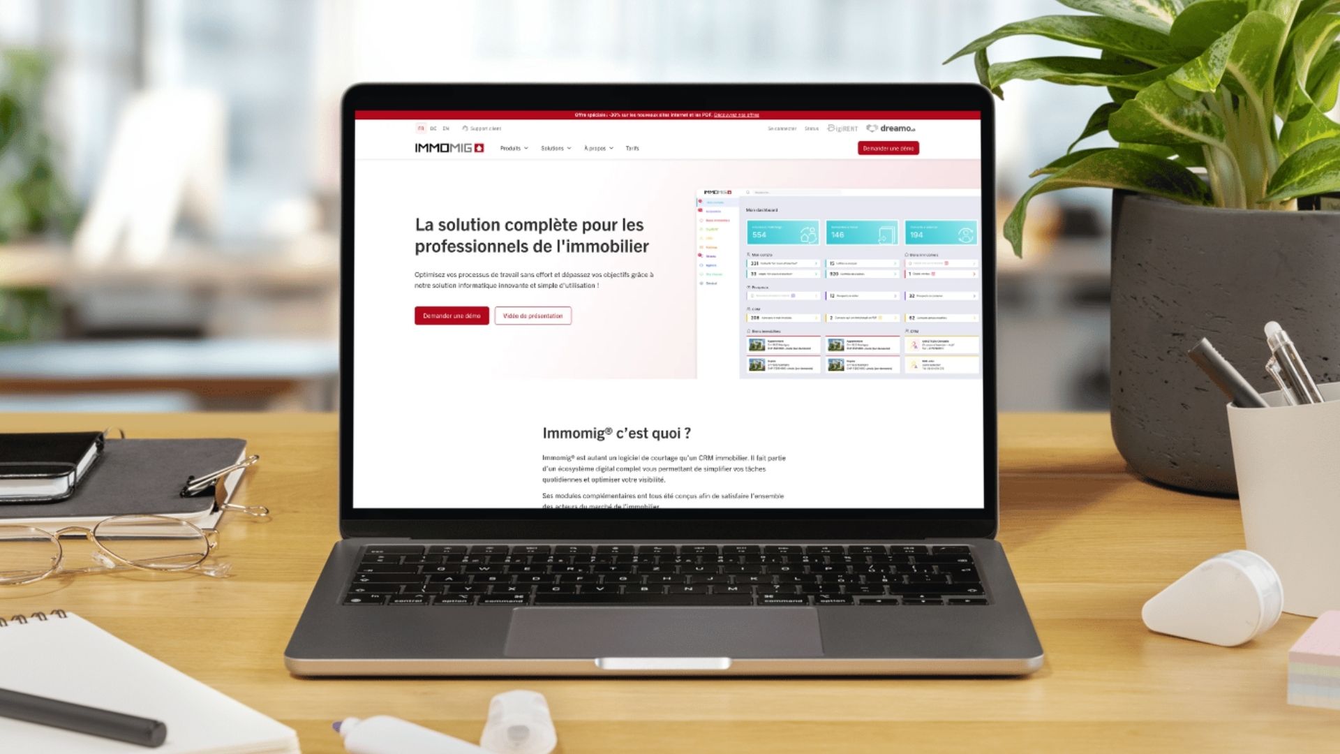 The new IMMOMIG SA website displayed on a laptop, illustrating the digital solutions dedicated to real estate professionals.