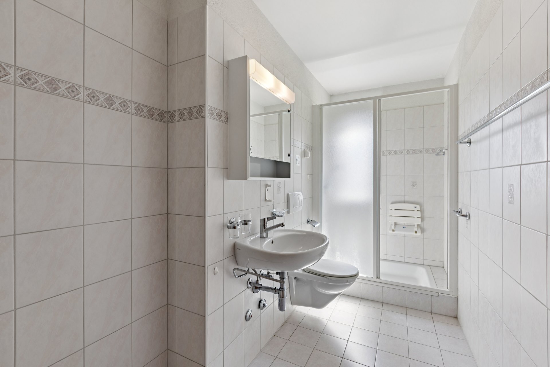 Bathroom with shower, washbasin and WC Bathroom with shower, washbasin and WC