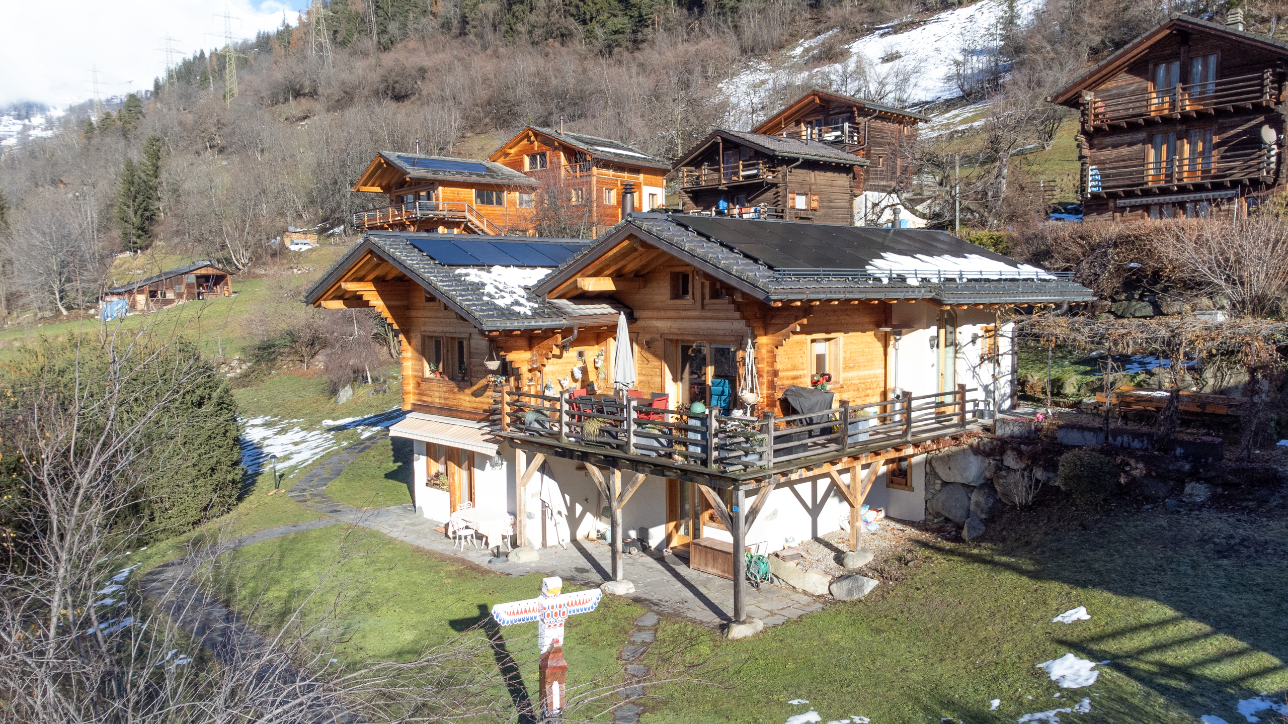 Exterior chalet view with terrace and mountain view – Chalet La Tsombe for sale Verbier
