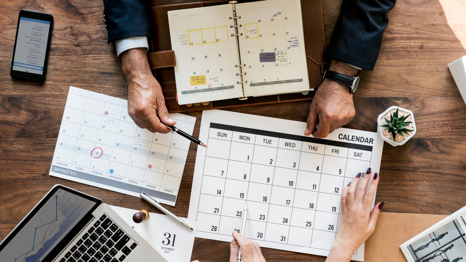 Annual calendar on a desk illustrating IMMOMIG SA’s 2024 year in review and the company’s key events and achievements.